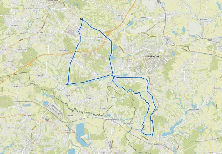 Mapa z zaznaczoną trasą rowerową wokół Wodzisławia Śląskiego, prowadzącą przez okoliczne miejscowości i tereny zielone.