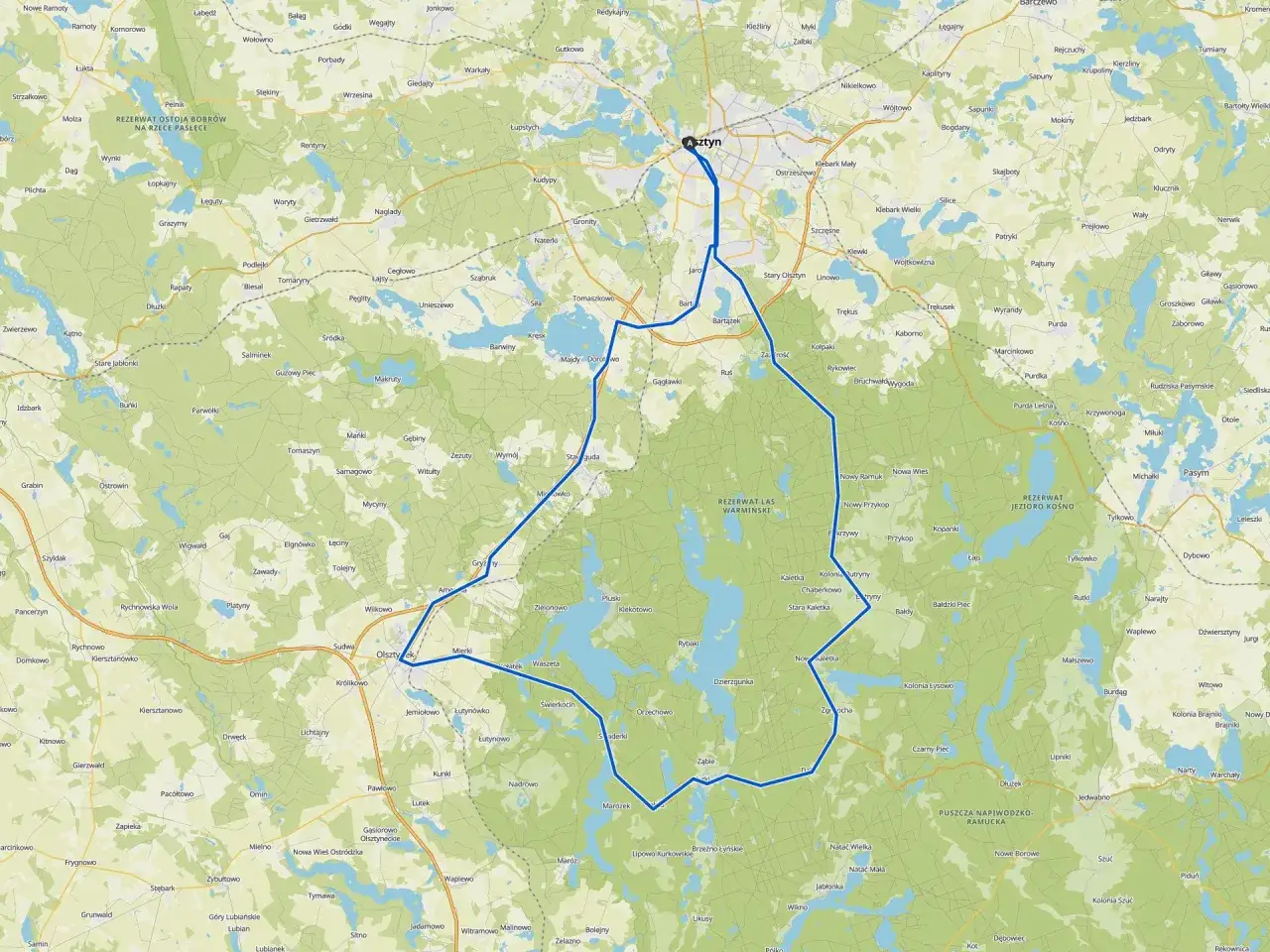 Mapa z zaznaczonymi trasami rowerowymi wokół Olsztyna, prowadzącymi przez malownicze jeziora i rezerwaty przyrody.